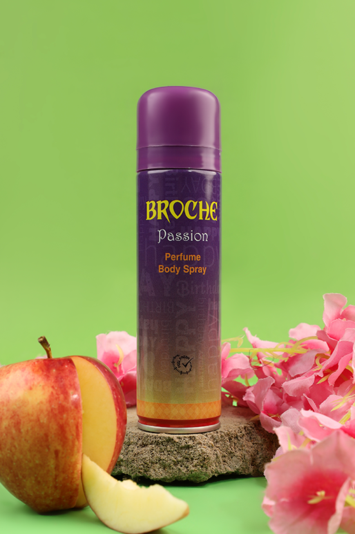 broche-body-spray-passion-150ml-aluminum-bottle-on-rocks-with-apple-slices-and-flowers