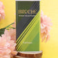 broche-furious-talcum-powder-125gm-on-wooden-surface-and-pink-flowers-in-background