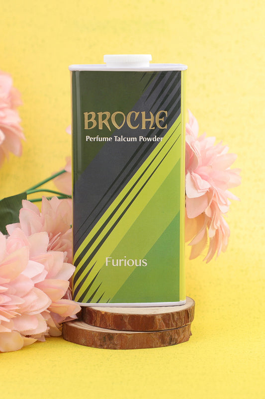 broche-furious-talcum-powder-125gm-on-wooden-surface-and-pink-flowers-in-background