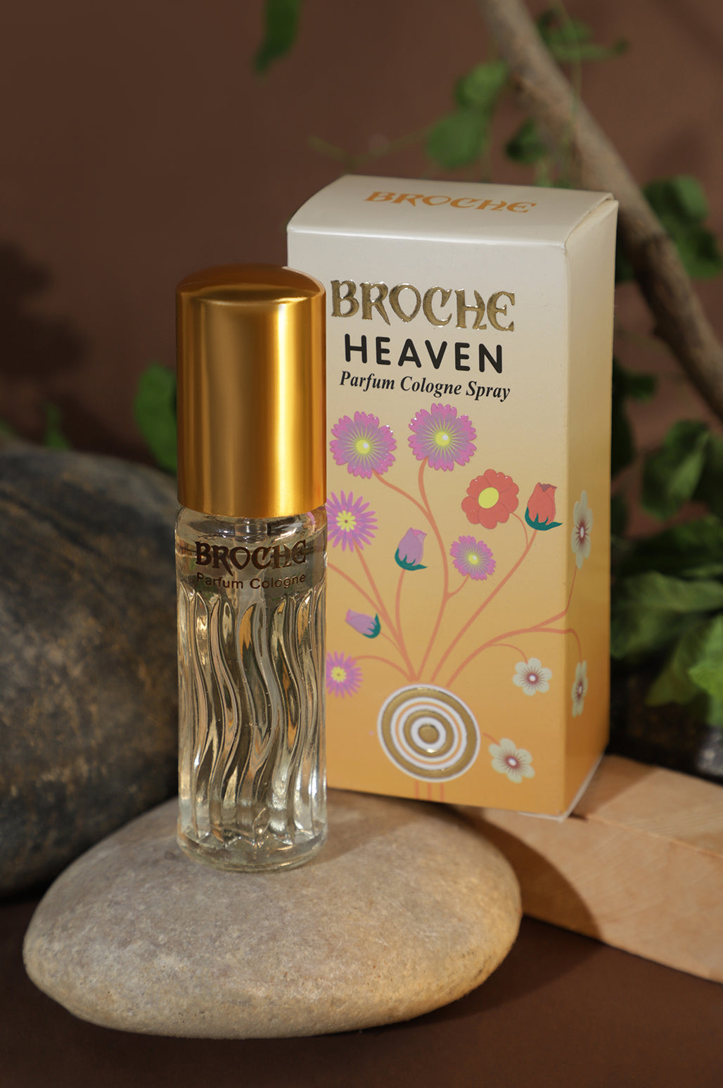 broche-heaven-perfume-15ml-bottle-and-packaging-on-rock-with-natural-background