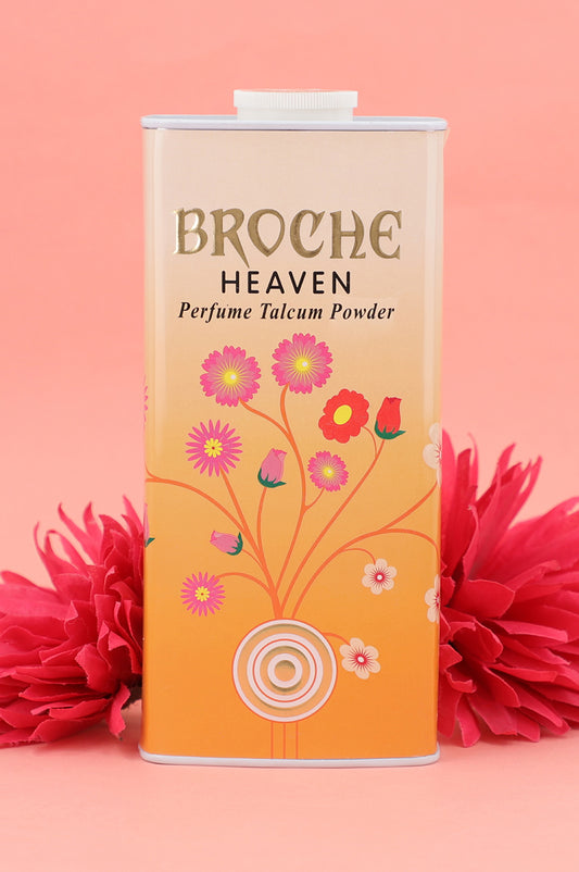 broche-heaven-talcum-powder-aluminum-container-with-flowers-arwork-and-flowers-in-the-background