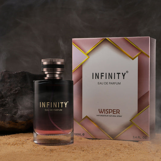 broche-infinity-wisper-eau-de-perfume-100ml-bottle-and-packaging-on-sand-with-natural-background